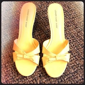 Pale yellow slip ons